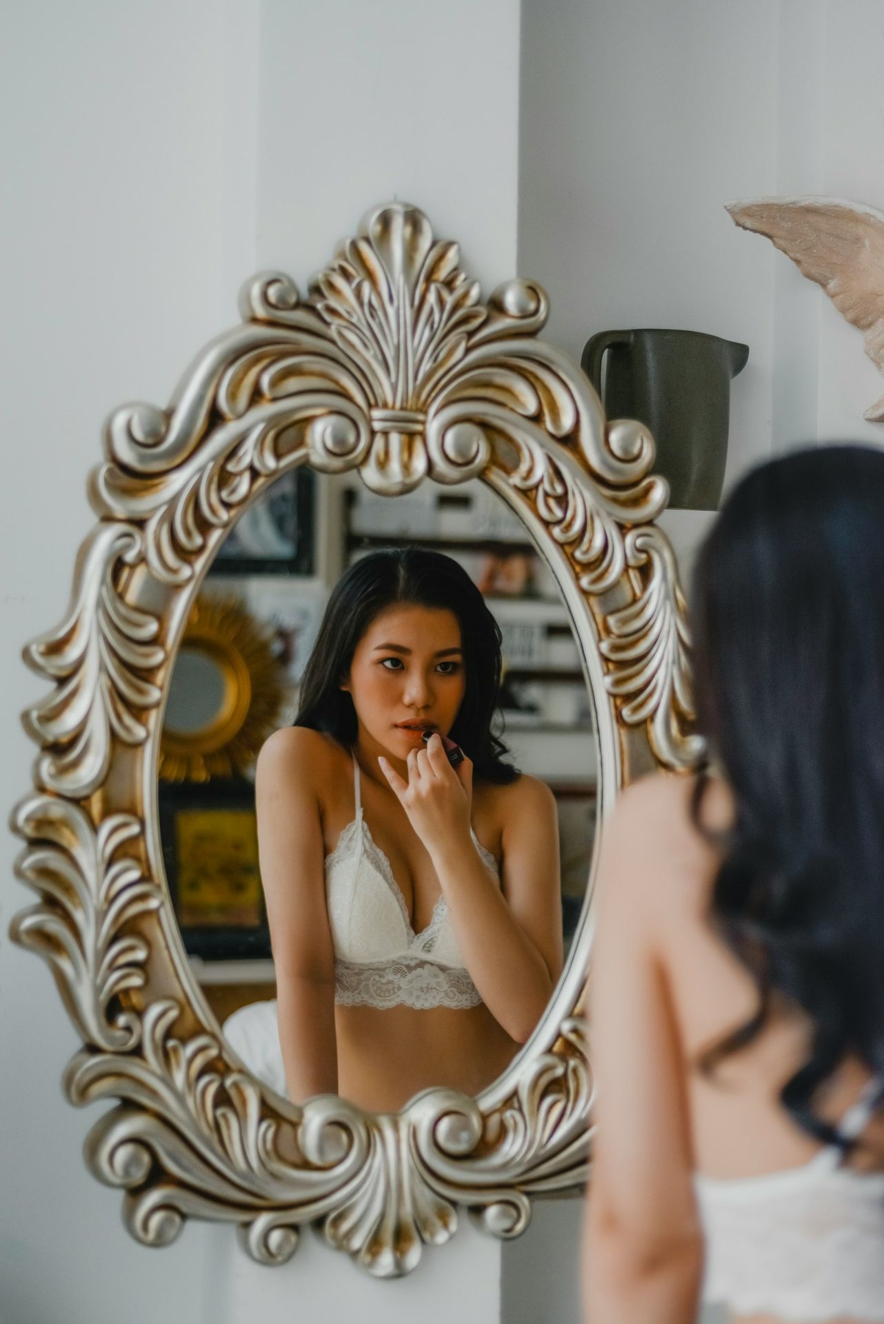 woman in white floral lace brassiere